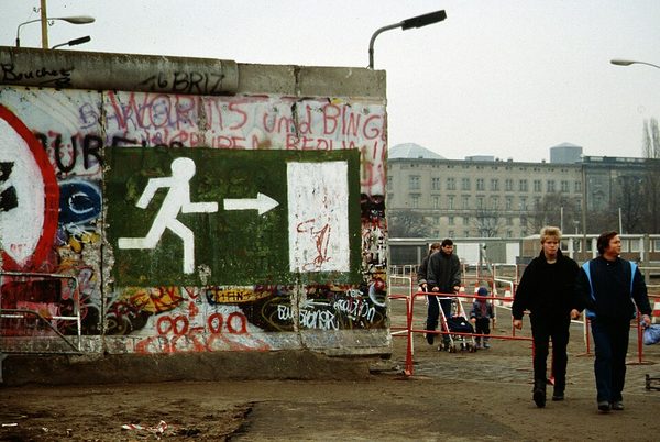 The Berlin Wall falls as the Iron Curtain crumbles